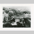 Three men with radio (ddr-densho-1007-413)