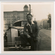 Man standing in front of car (ddr-densho-426-2108)