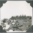 Men lying on ground near row of tents (ddr-ajah-2-230)