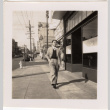 Man walking down street (ddr-densho-426-26)