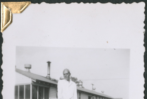 African American man posing outside building (ddr-densho-434-180)