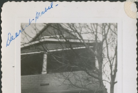 A woman in front of a house (ddr-densho-298-195)