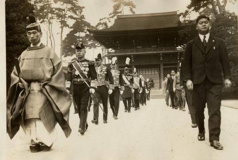 A Shinto priest, military leaders, and civilians walking in front of a shrine (ddr-njpa-8-50)