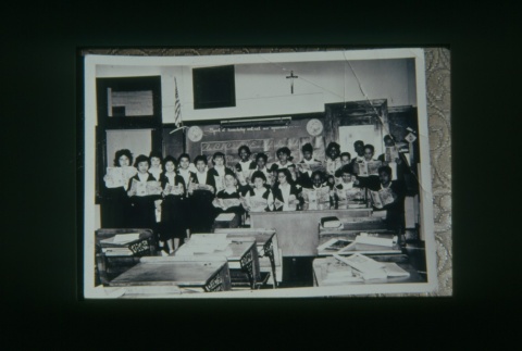 (Slide) - Image of boys and girls at front of classroom reading (ddr-densho-330-167-master-8dea7475d9)