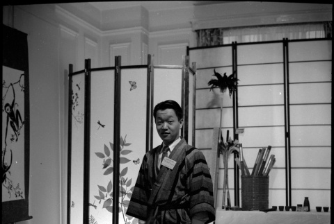 Man in robe, with name tag (ddr-densho-426-2476)