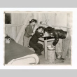 Three girls in their quarters at Manzanar (ddr-csujad-52-9)