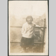 Girl standing by railing (ddr-densho-293-71)