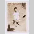 Photo of a toddler holding a lunch pail (ddr-densho-483-745)