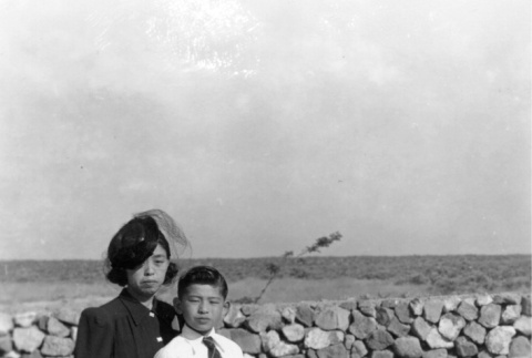 Mother and son in a camp graveyard (ddr-densho-2-52)