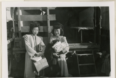 Michi and Sada Anraku holding parcels (ddr-densho-37-880)