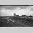 Gate Number 3 from outside camp looking along the perimeter (ddr-densho-570-46)