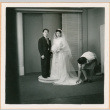 Henri Takahashi and Tomoye (Nozawa) Takakashi posed for photo, woman adjusting dress (ddr-densho-410-470)