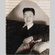 Man sitting on couch (ddr-densho-464-129)