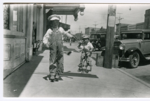 Toru and Susumu Miyoshi in front of Guadalupe General Merchandise Store (ddr-densho-480-154)