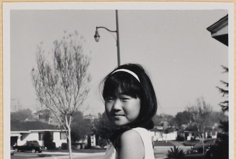 Girl standing in yard (ddr-densho-522-124)