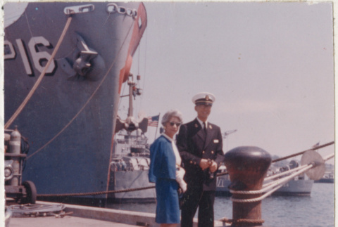 Agnes Sakura and  Gerald Sakura standing next to navy ship (ddr-densho-523-371)