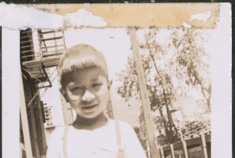 Young boy in alleyway (ddr-densho-483-1030)