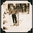 Walter Matsuoka stands with skis (ddr-densho-390-100)