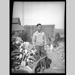Frank Miwa standing in a garden (ddr-densho-475-89)