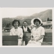 Three women seated in a park (ddr-densho-338-96)