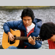 Art Kobayashi playing guitar at morning watch (ddr-densho-336-361)