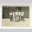 Nisei men's basketball team in front of barrack (ddr-csujad-44-20)