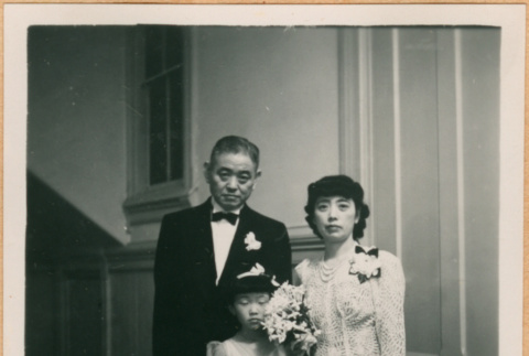 Flower girl Kashiwa Arizawa with man and woman (ddr-densho-410-510)