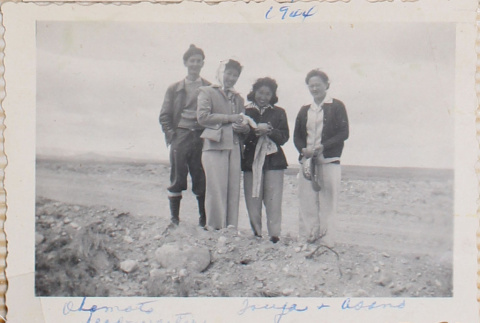 Four people standing on hill (ddr-densho-464-70)