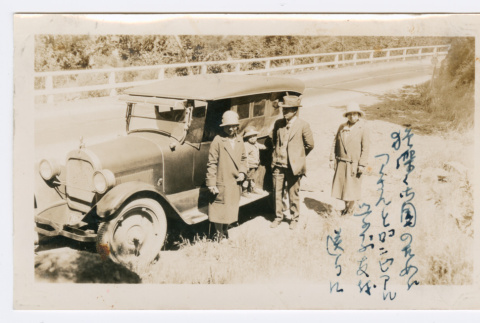 Family next to car (ddr-densho-480-89)