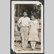 boy and girl leaning against a fence (ddr-densho-378-537)