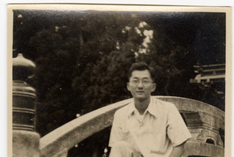Man standing by tree (ddr-densho-587-98)