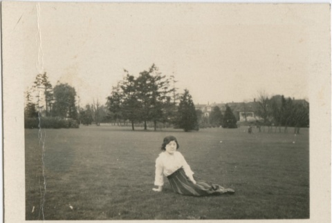 A woman sitting in a field (ddr-densho-296-131)