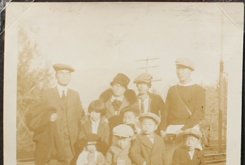 Japanese American family at train station (ddr-densho-259-210)