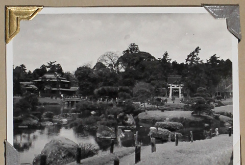 View of a path and pond in a Japanese garden (ddr-densho-404-287)