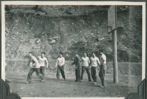 Men playing basketball (ddr-ajah-2-358)