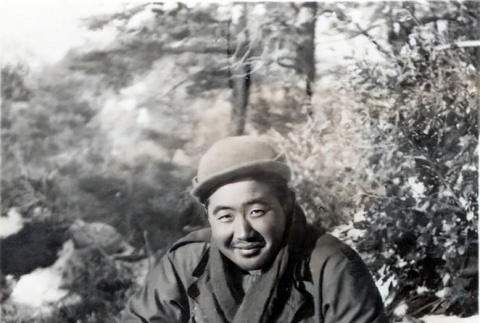 Ben Toru Yoshida eating from mess kit in snow (ddr-densho-474-227)