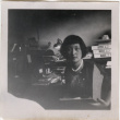 Woman at desk with paperwork (ddr-densho-426-889)