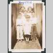 Four girls and two boys in narrow passageway (ddr-densho-483-582)