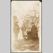 Three adults and one child holding doll (ddr-densho-293-54)
