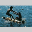 Campers log rolling in the lake (ddr-densho-336-1127)