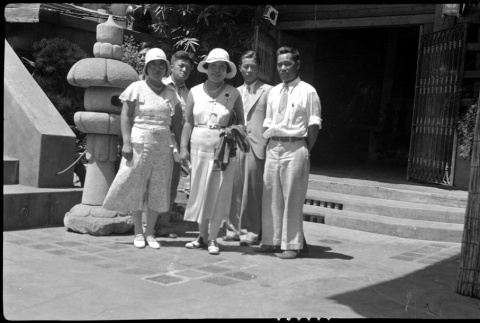 A group of adults wearing formal clothes in front of a building (ddr-densho-480-32)