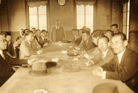 Men gathered at a table (ddr-njpa-4-2407)