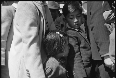Two children waiting in line for bus (ddr-densho-151-150)