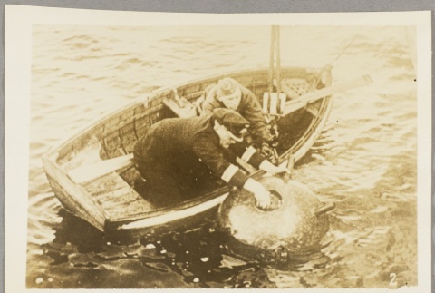 A Kreigsmarine officer and sailor planting a sea mine (ddr-njpa-13-989)