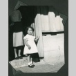 A young girl standing in a doorway (ddr-densho-328-487)