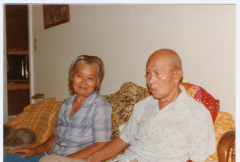 Two people sitting on couch (ddr-densho-501-59)