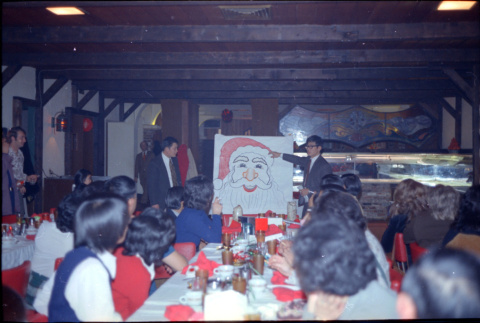 Two men with drawing of Santa Claus (ddr-densho-426-1180)