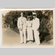 Tomoye (Nozawa) Takahashi standing with two men (ddr-densho-426-1525)