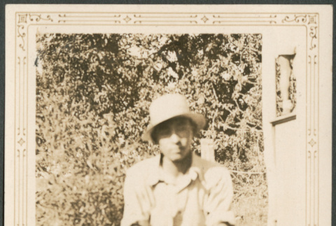 Man sitting on grass (ddr-densho-316-281)