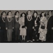 Kabuki actor and others posing wearing leis (ddr-njpa-4-1598)